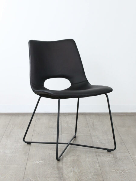 Baxter dining chair in guntmetal black leather colour front angle view
