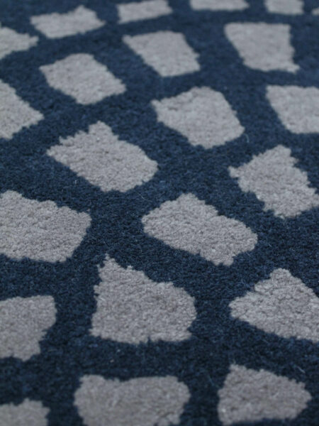 Cobblestone navy blue and grey handtufted wool rug close up