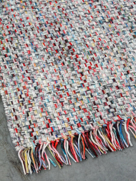 Bijou handwoven multi colour rug with fringe corner image