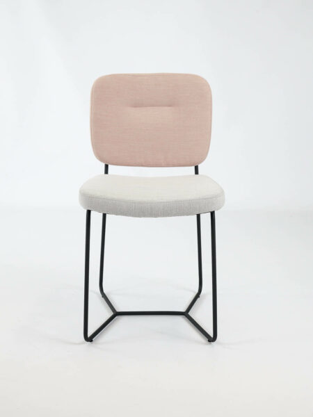 Candy dinign chair in two tone fabric in pink and natural with black legs front on image