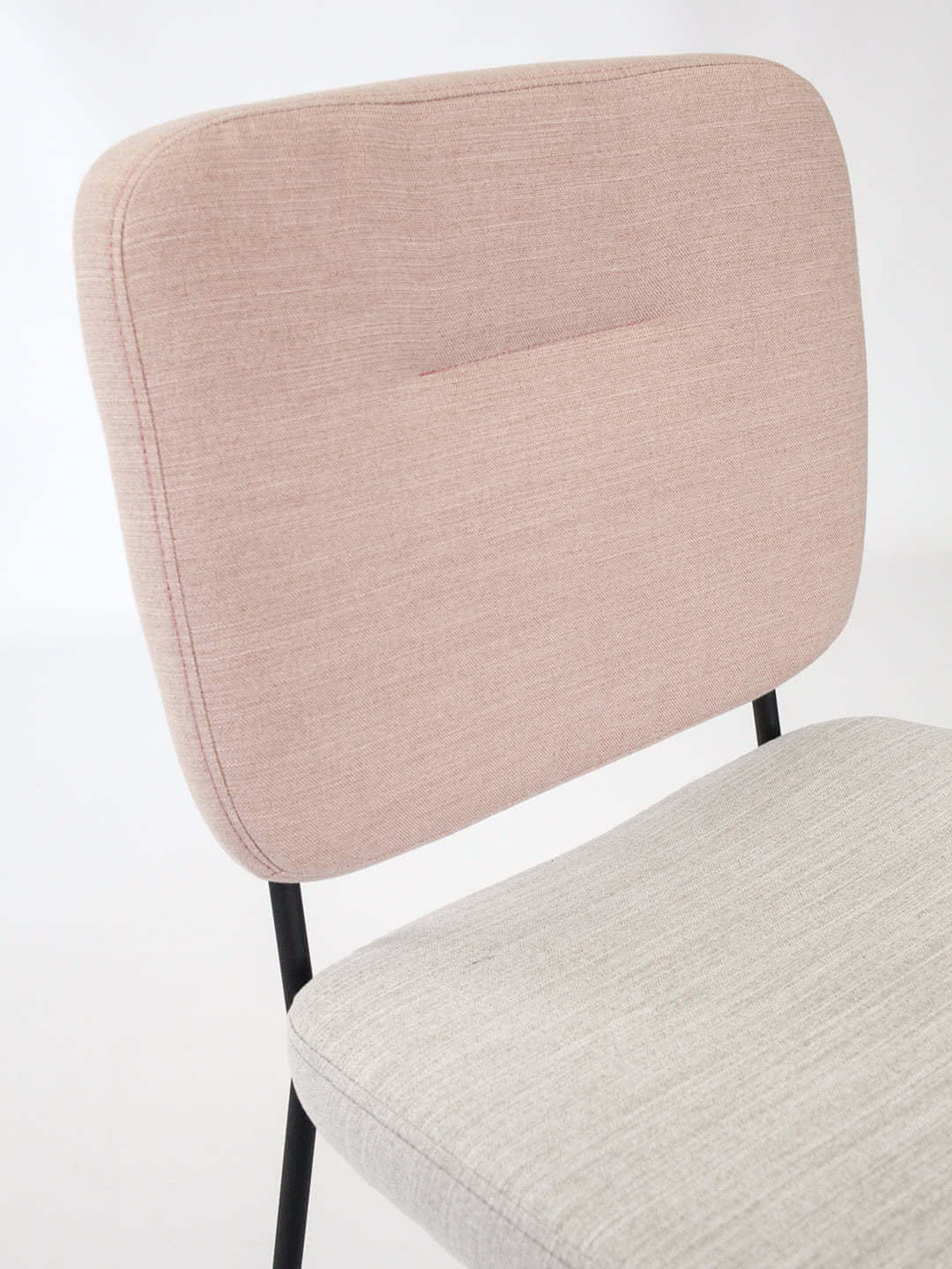 Candy dinign chair in two tone fabric in pink and natural with black legs detail of chair