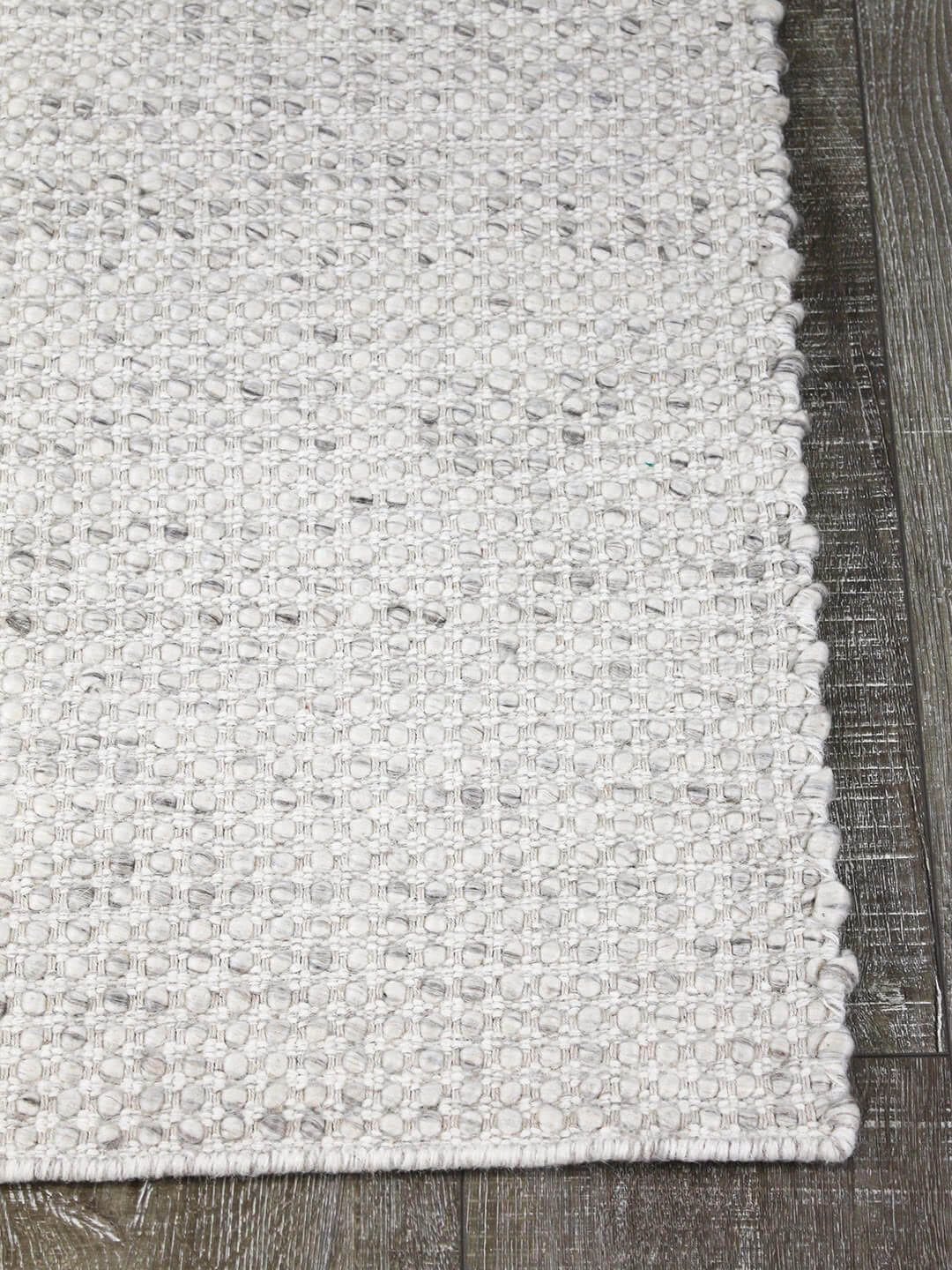 Kober flatweave pure 100% wool rug in grey silver corner image with floorbaords
