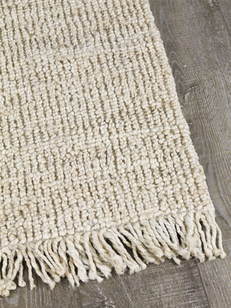 Popcorn Cloud handwoven jute rug with fringe - corner image