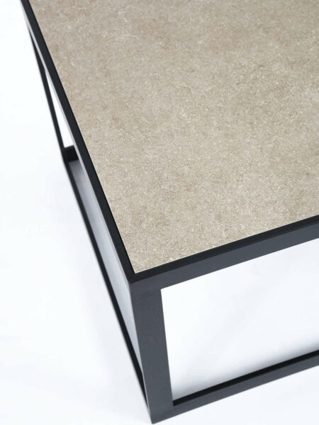 Ezra Stone beige side table with black metal frame