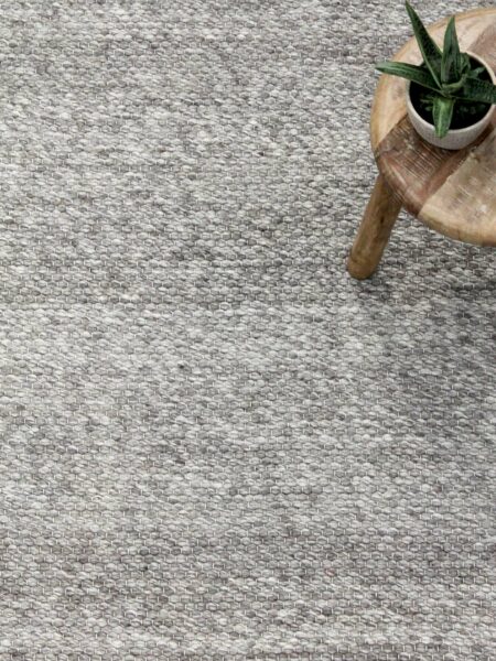 Hunter textured flatweave Rug in silver grey handmade from wool. Lifestyle image