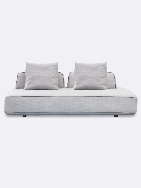a white couch with two pillows