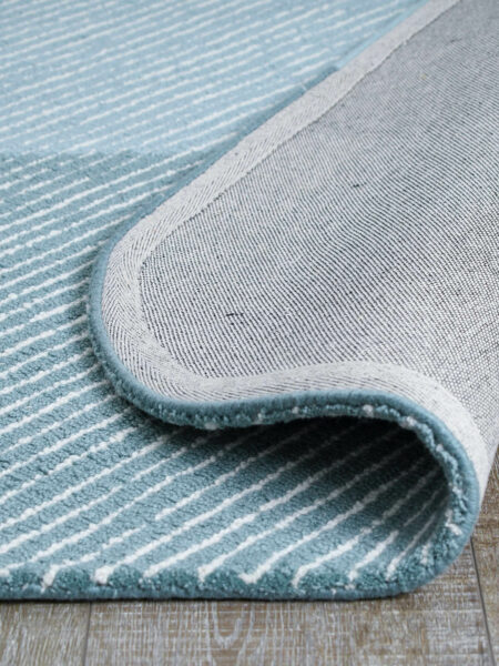 Pinstripe Oasis modern handtufted loop pile rug in blue tones - backing