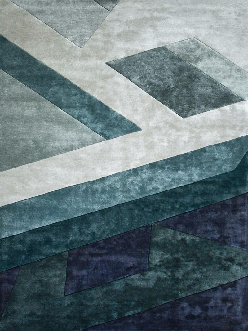 Evolve Marine handtufted artsilk rug with geometric pattern in teal green tones