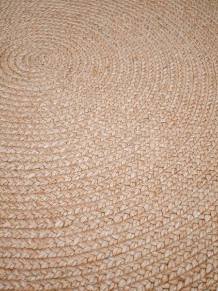 Paddington Clay handwoven plaited round rug handmade in wool and artsilk blend
