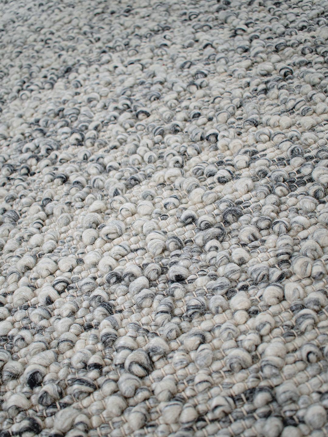Boucle wool rug in smoke detail
