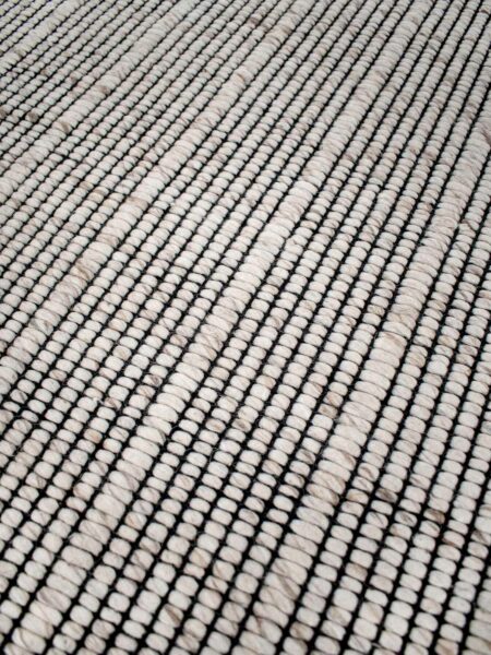 Cable beige sand handwoven rug by the rug collection insitu texture