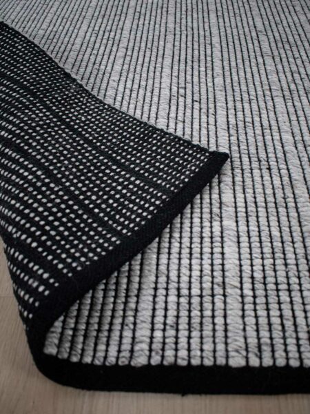 Cable silver grey handwoven rug by the rug collection back