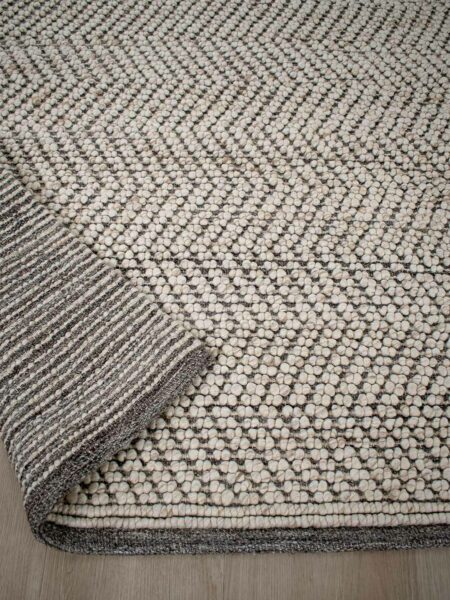 Caspian Beige textured chevron design rug handwoven in wool and artsilk - back image