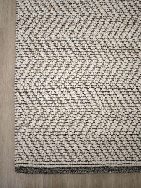 Caspian Beige textured chevron design rug handwoven in wool and artsilk - corner image