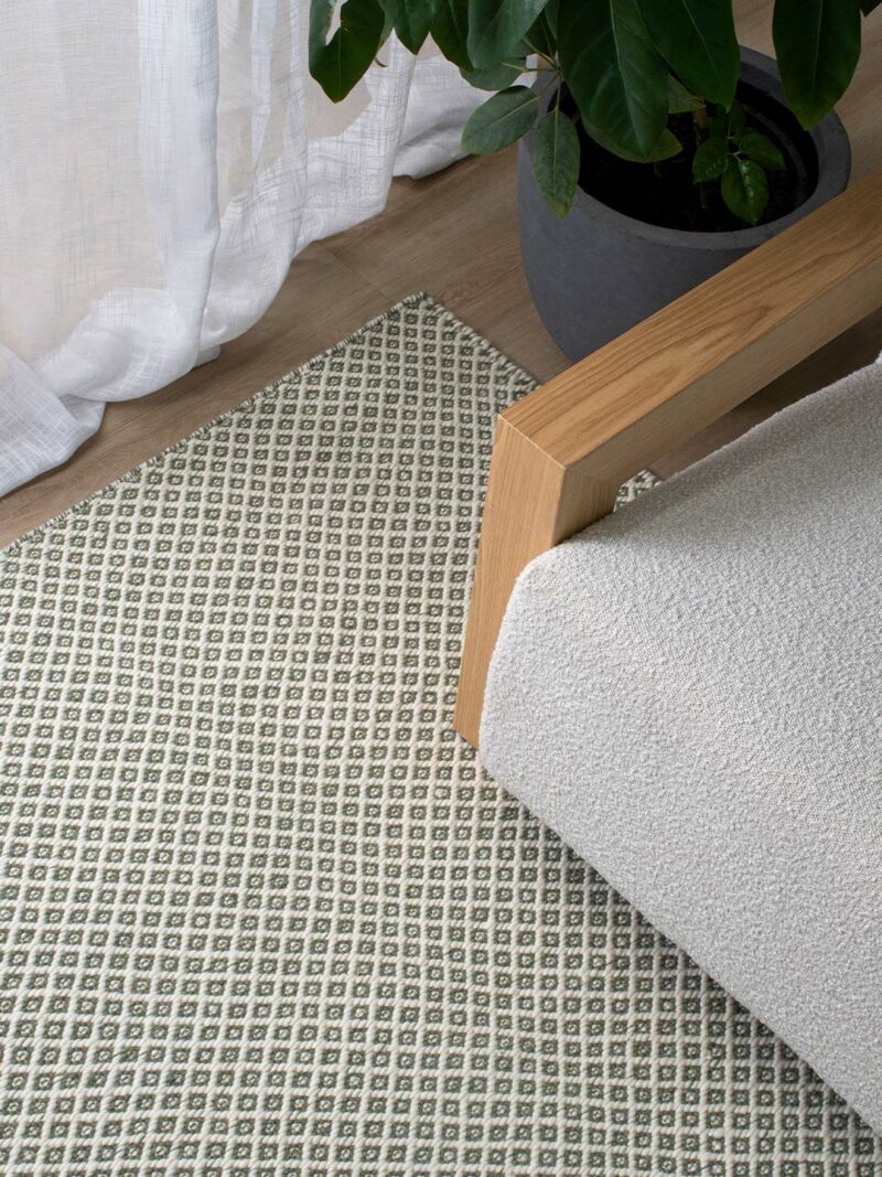 Rubick green ivory flatweave by The Rug Collection insitu
