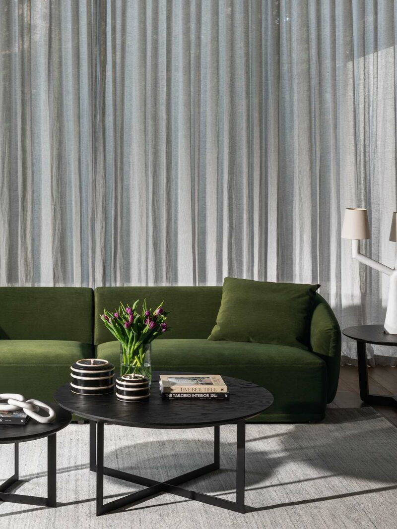 Gemma Sofa Forest insitu a green couch in a room