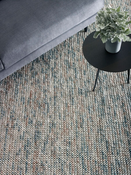 Magic Rug is a handmade pure wool textured rug in pinks and teal greens