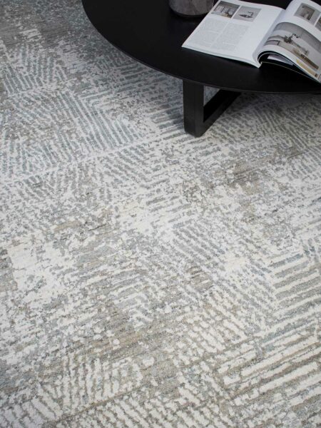 Regency Rug in Casper grey colour with table and magazine image at Tallira By The Rug Collection